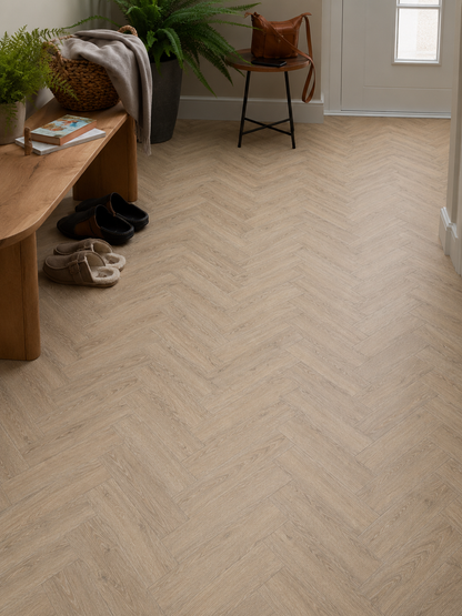 Amazon Oak Herringbone SPC flooring in a modern hallway with authentic oak effect wood grain, waterproof luxury vinyl flooring, light oak herringbone pattern, neutral home décor, entrance hallway styling, durable family-friendly flooring and contemporary interior design.