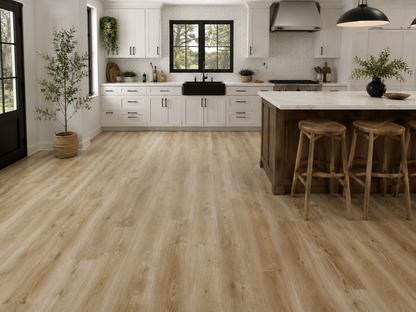 Ashdown Light Oak Luxury Click Vinyl Flooring 6mm installed in a bright contemporary kitchen, featuring wide light oak-effect planks with warm natural tones, authentic wood grain detailing, subtle knot patterns and a realistic embossed matt finish, paired with white shaker cabinets, a farmhouse sink and a large kitchen island.