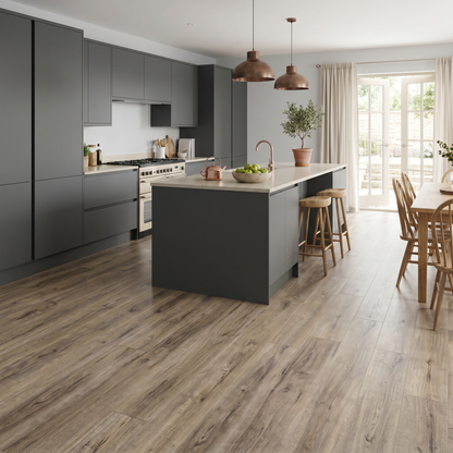 Cartmel Oak Luxury Click Vinyl Flooring 5mm installed in a contemporary open-plan kitchen, showcasing warm oak wood-effect SPC planks with authentic natural grain, subtle knot detailing and a realistic matt finish, creating a stylish, durable and waterproof family living space.
