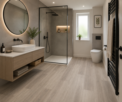 Modern contemporary bathroom featuring Epping Teak Grey Luxury Click Vinyl Flooring with cool grey wood-effect wide planks, realistic wood grain, subtle natural knot detailing and an embossed matt finish. Waterproof SPC rigid core flooring ideal for stylish family bathrooms