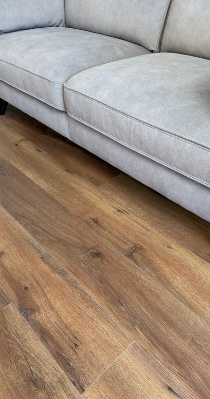 Real customer installation of Hawkshead Oak luxury click vinyl flooring in a modern living room, showcasing authentic oak wood grain, rich natural tones and realistic plank detail. Waterproof, scratch-resistant SPC flooring ideal for busy family homes, pets and everyday living.