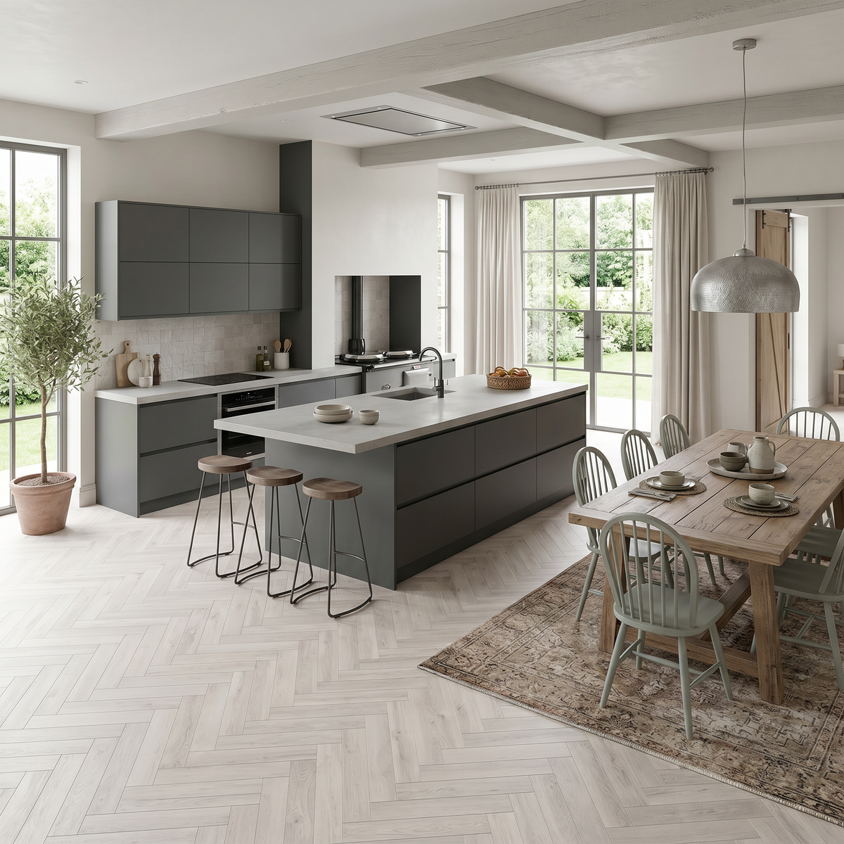 Ivory Herringbone Luxury Click Vinyl Flooring 5mm installed in a contemporary open-plan kitchen and dining room featuring soft pale grey wood-effect SPC herringbone flooring with authentic natural grain, subtle knot detailing and a realistic matt finish, creating a bright, elegant and timeless living space.
