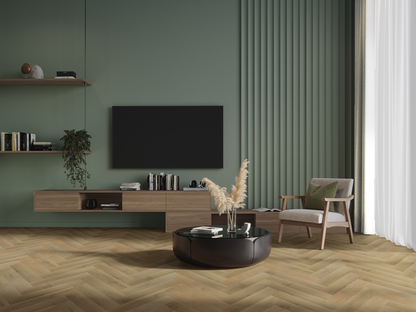 Fireside Herringbone Luxury Click Vinyl Flooring 5.5mm installed in a contemporary living room with sage green walls, natural oak-effect herringbone flooring and modern Scandinavian furniture.
