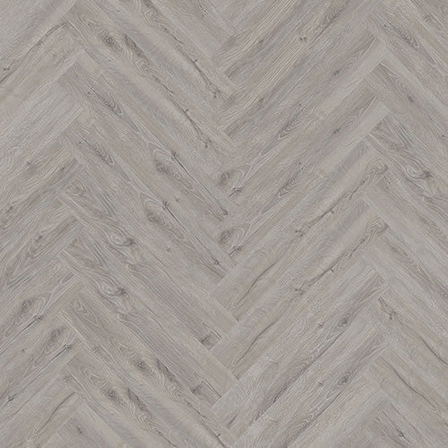 Gran Canaria Herringbone Luxury Click Vinyl Flooring 5mm close-up featuring elegant mid-grey wood-effect SPC herringbone planks with authentic natural grain, realistic knot detailing, subtle texture and a matt finish, creating a timeless, contemporary flooring design.