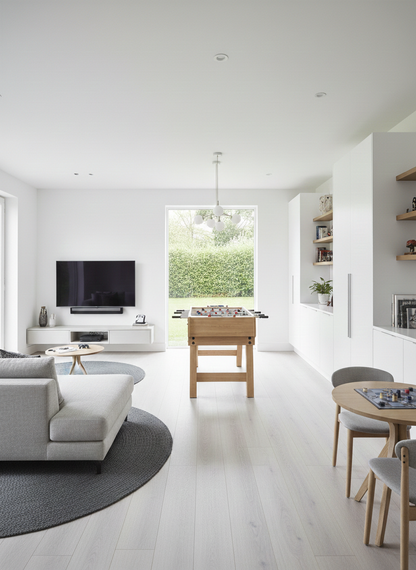 Ivory Luxury Click Vinyl Flooring 5mm installed throughout a bright open-plan living space, featuring soft ivory wood-effect SPC flooring with authentic natural grain, subtle knot detailing and a realistic matt finish, creating a clean, modern interior filled with natural light.