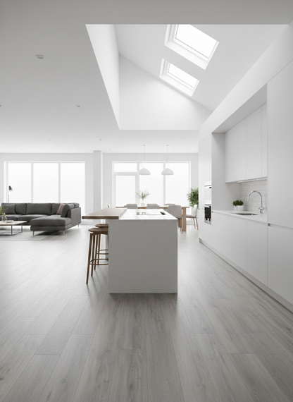 Azure Grey Luxury Click Vinyl Flooring 5mm installed throughout a bright open-plan kitchen and living space, showcasing cool grey wood-effect planks with authentic grain detailing and a realistic matt finish, complementing contemporary white cabinetry and large rooflights.